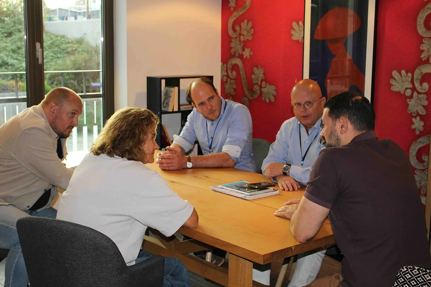 PUC members exchanging ideas around a table